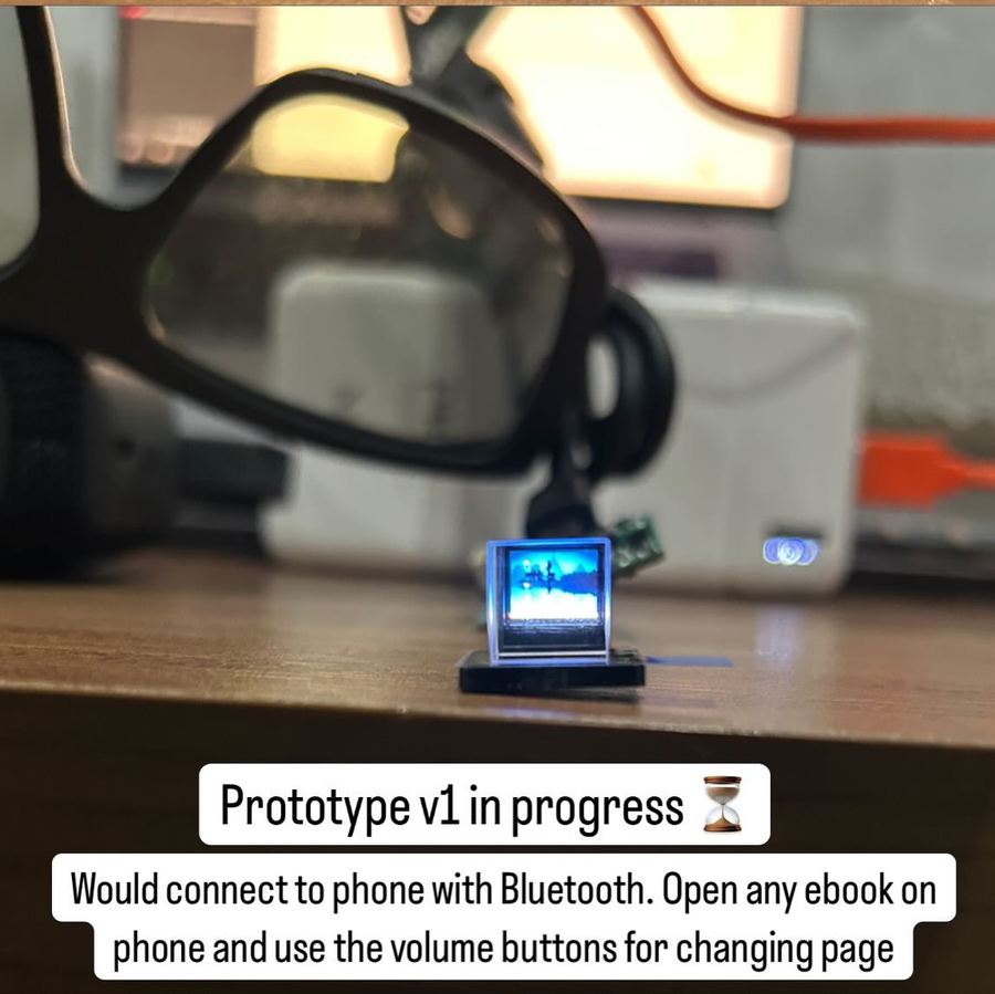 Early prototype on a desk with a small glowing display
