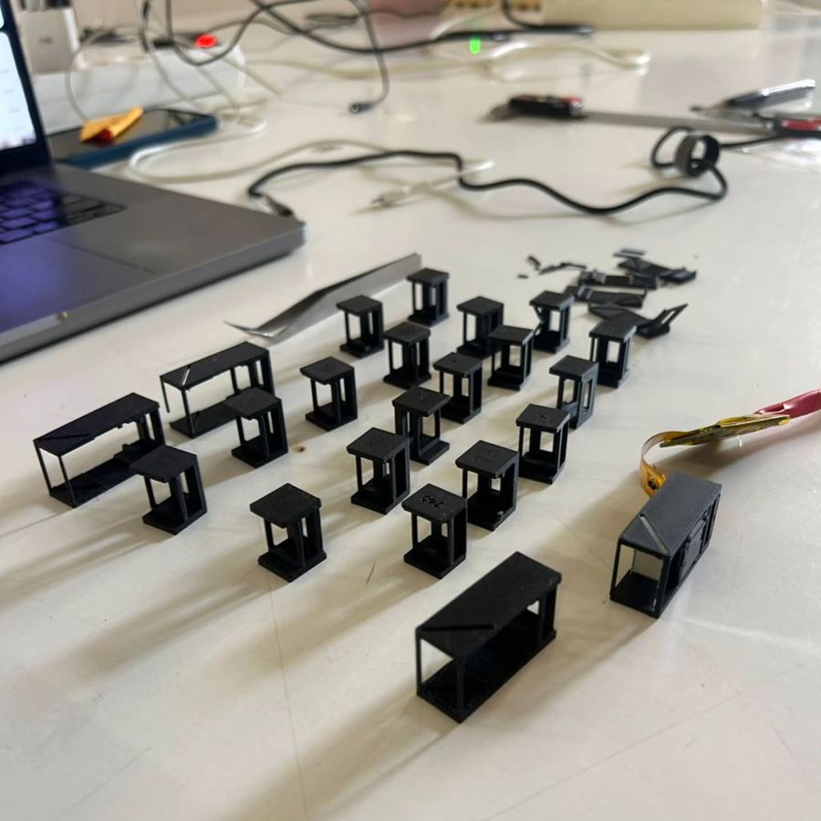 Rows of small printed optics housings