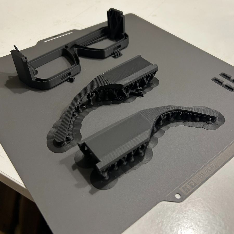 Printed frame parts on a printer bed