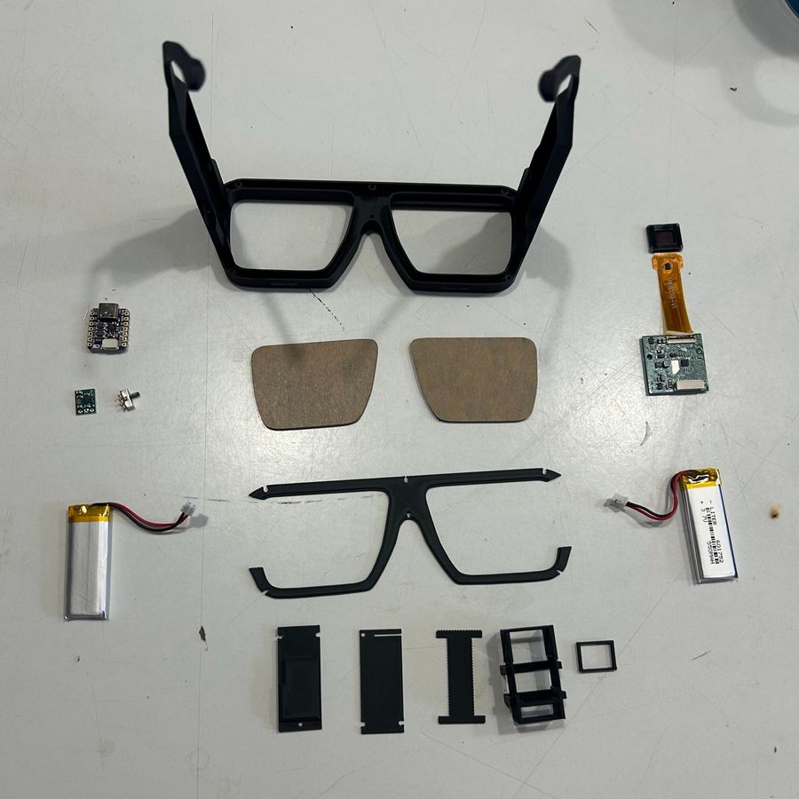 Version 6 parts laid out: frame, lenses, batteries and boards