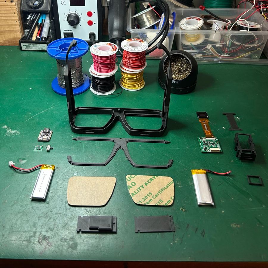 Version 6 parts on a green cutting mat during assembly