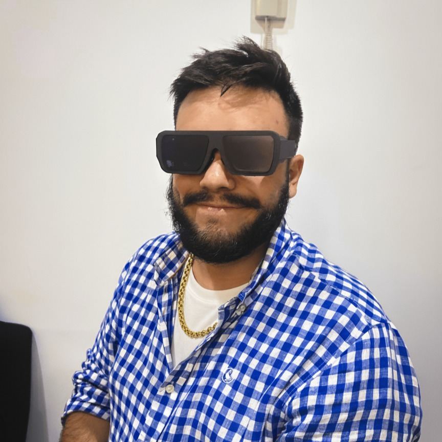 A man in a checked shirt wearing the glasses
