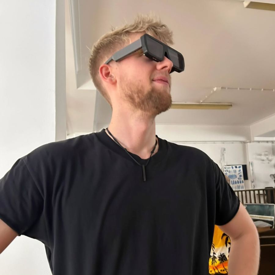 A man looking up through the glasses