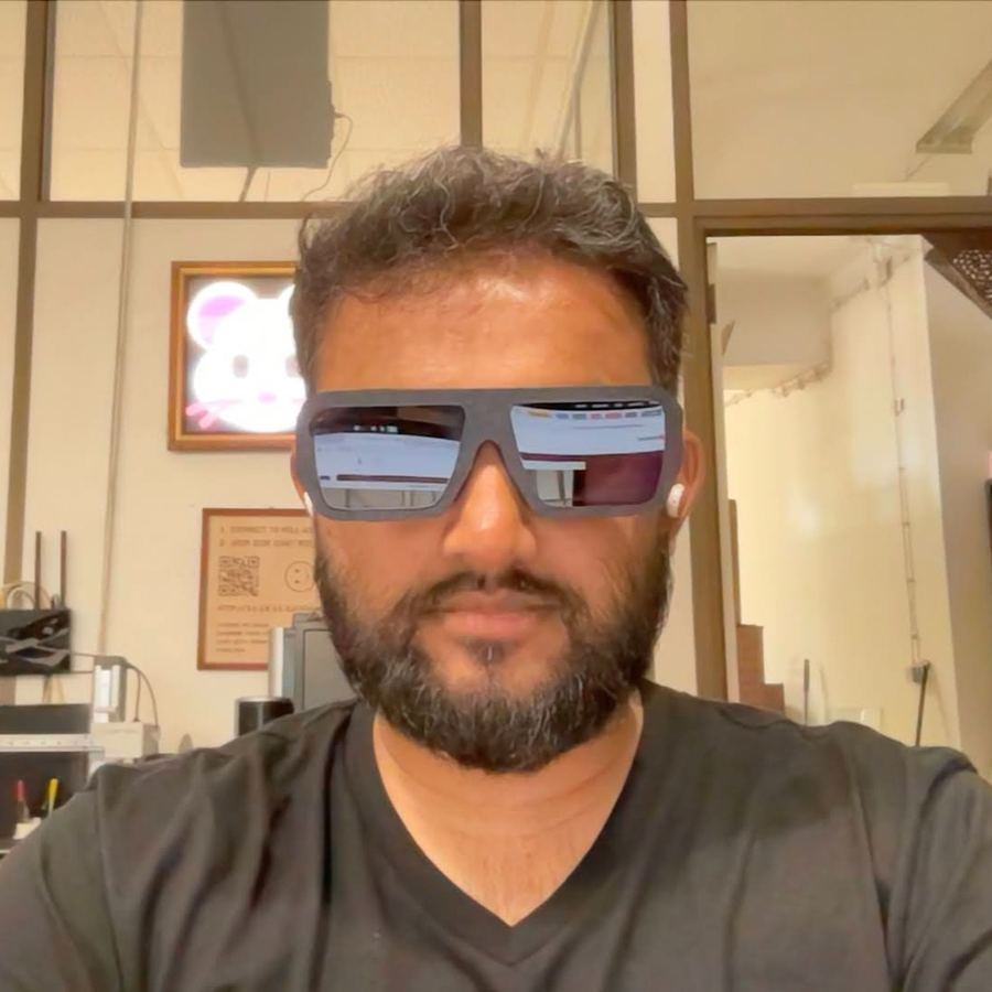 A man wearing version 5, which looks like ordinary sunglasses